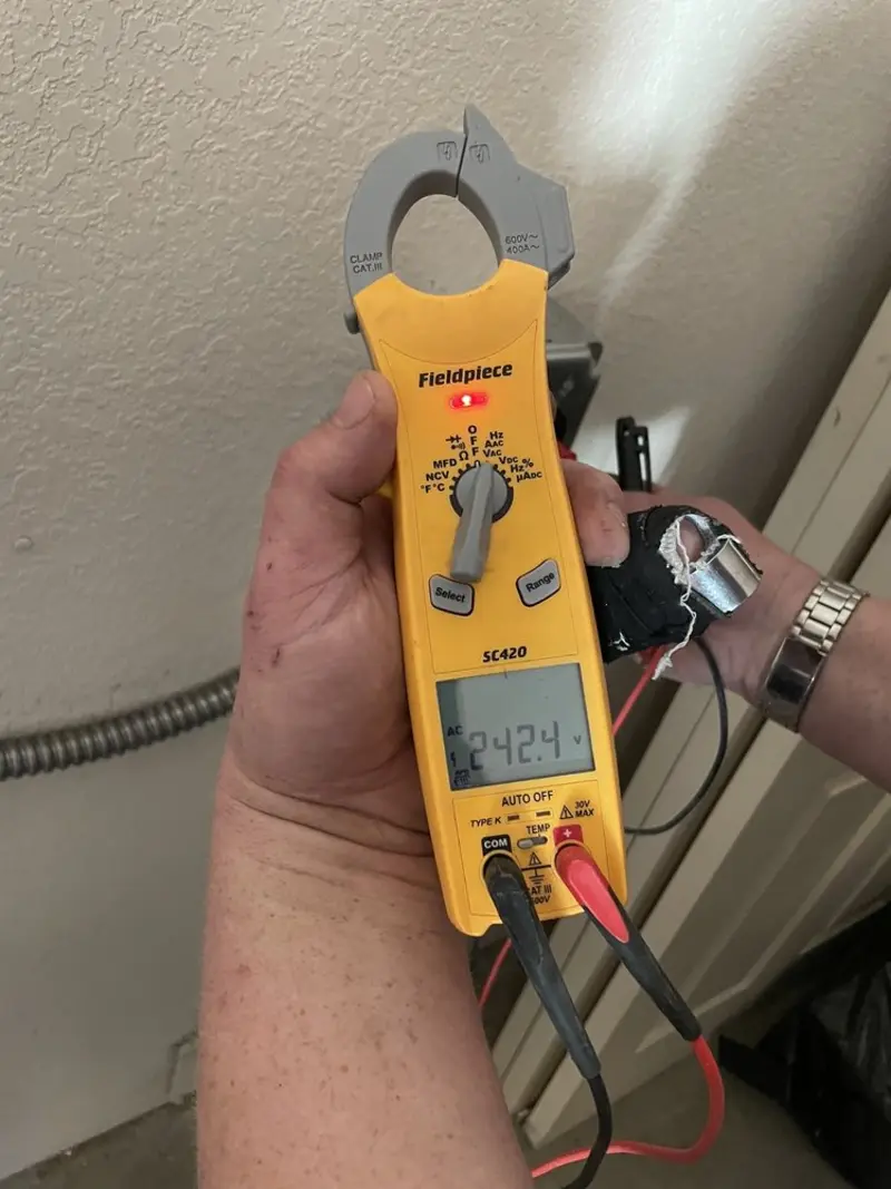 Voltage testing with clamp meter during Electrical Installation Services in Elm Creek